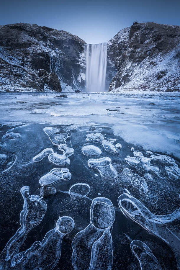 Spotted these beautiful ice bubbles at the iconic Skogafoss waterfall in Iceland yesterday OC
