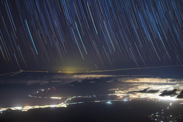 Star trails from the surprisingly snowy summit of the Haleakal volcano on Maui HI 