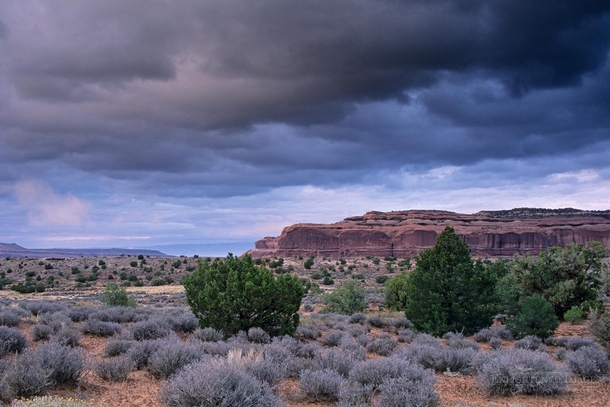 Storm clouds over a mesa in Canyonlands National Park Utah 