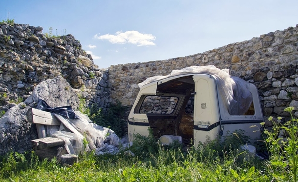 Stripped out camper within the castle walls Mirw Poland 