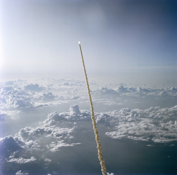 STS- on its way through the clouds with the first American woman ever in space aboard   x 