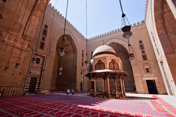 Sultan Hassan mosque a masterpiece of mamluk architecture and is the most compact and unified of all Cairos monuments 