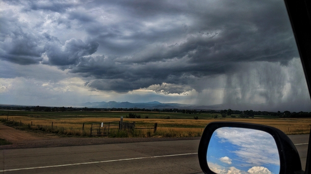 Summer rainstorm on the Colorado plains ahead blue skies behind