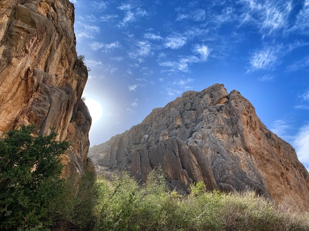Sun peeking out from behind the walls of Dog Canyon in Big Bend National Park in Texas 