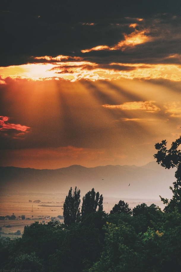 Sun rays over my home town in Bosnia during Summer Cant wait to roam these Livno hills again 