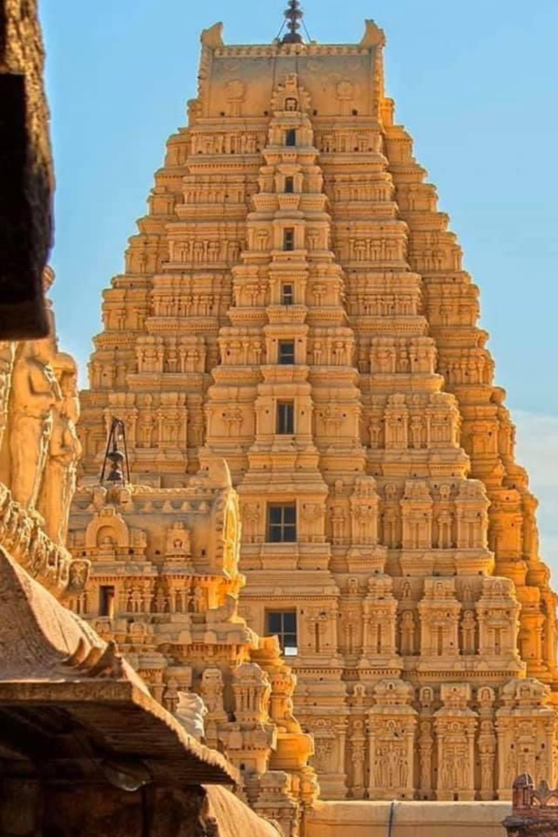 Sun soaked Virupaksha Temple Hampi INDIA was completed in th century using precise mathematical concepts to build and decorate it The temple is among the few structures that withstood the invasion that destroyed the entire city of Vijayanagaram