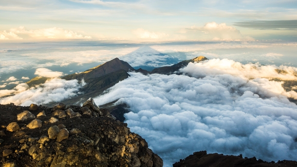 Sunrise at Mount Rinjani in Lombok - m - with its own shadow in the clouds 