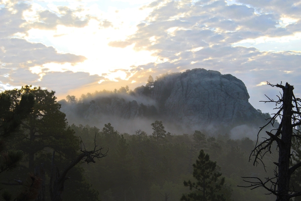 Sunrise in the Black Elk Wilderness Black Hills South Dakota Taken two weeks ago Due to unusually high humidity I woke up in a bank of fog which cascaded off the granite monuments as the sun rose 