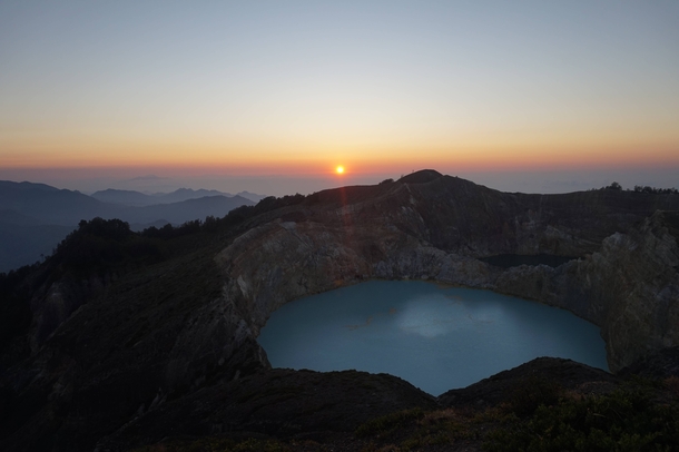 Sunrise over Volcanic Lakes which appear the consistency of paint at the summit of Gunung Kelimutu Flores Indonesia 