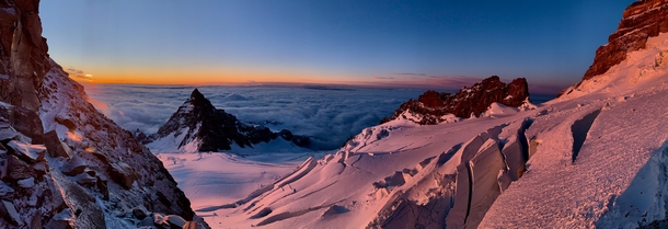 Sunrise panorama while climbing Mt Rainiers Disappointment Cleaver Route with views of Little Tahoma and Ingraham Glacier 
