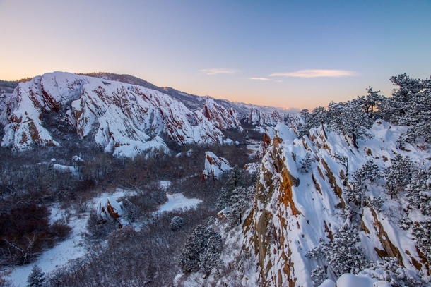 Sunset over Roxborough State Parks red rocks after some fresh snowfall 