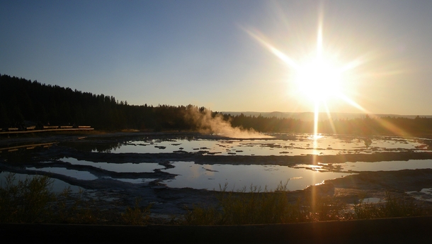 Sunset reflections over geyser pools Yellowstone National Park 
