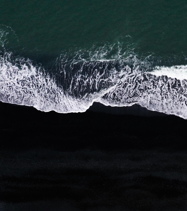 Surrealistic and beautiful at the same time a black beach in Iceland with the waves breaking  - IG glacionaut