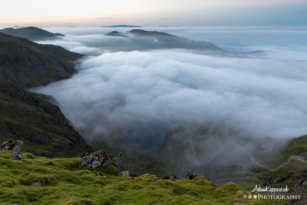 Surrounded by a cloud inversion at the top of Coniston Old Man The Lake District 
