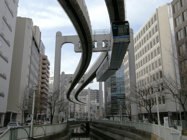 Suspended monorail cutting through the city Chiba Japan 
