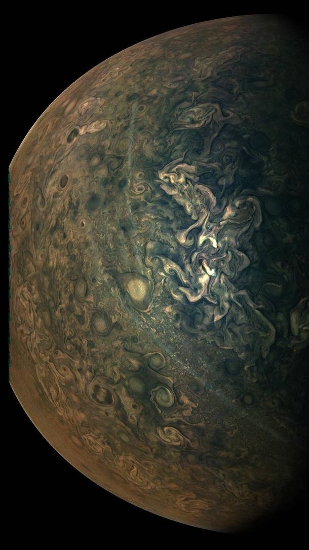 Swirling clouds and hazy streaks in Jupiters northern region viewed from  miles away
