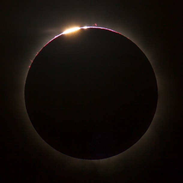 Telescopic snapshot from Queensland AU captures total solar eclipse and the rare Bailys Beads when sunlight streams through crevices and is blocked by mountains on the Moons rough surface 