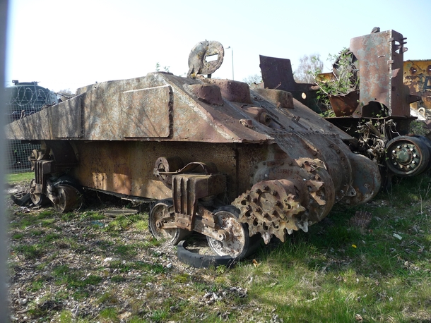 The abandoned and rusting hull of a Sherman tank 