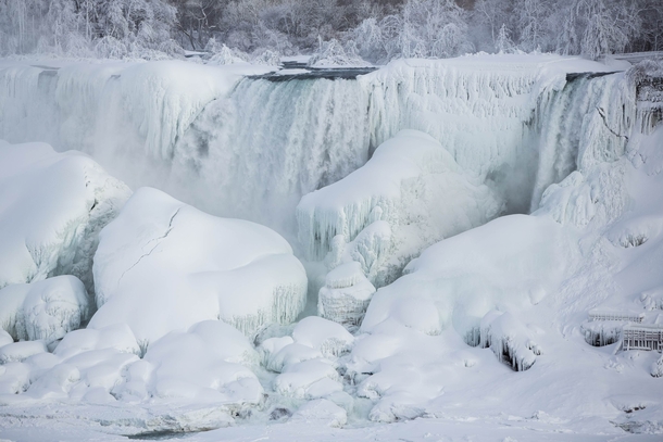 The almost frozen Niagara Falls  Photo by Lindsay DeDario xpost from rTrueNorthPictures