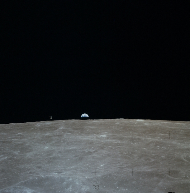 The Apollo  Command Module Casper and the Earth as viewed from the Lunar Module Orion 