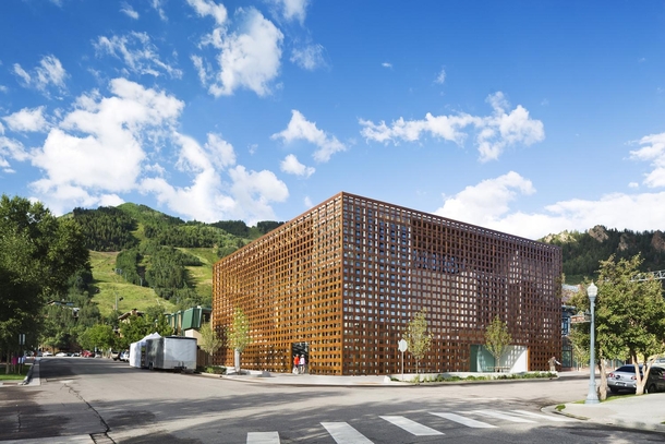 The Aspen Art Museum was designed by Japanese architect Shigeru Ban The museums inventive design includes a woven screen in Prodema a wooden product made of paper and resin and the roof is made of waves of wood