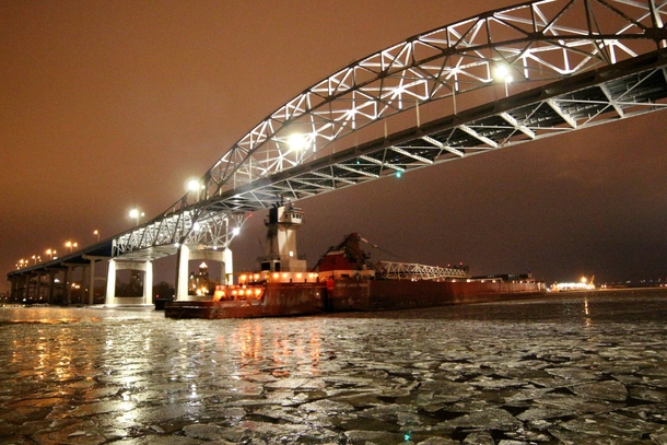 The Blatnick bridge and frozen Duluth MN Harbor with the bargetug combo Joyce Van EnkevortGreat Lakes Trader 