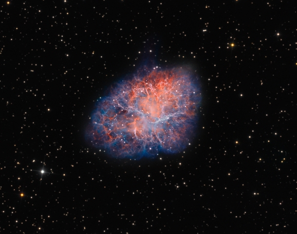 The Crab Nebula M the remnant of a supernova first witnessed by astronomers in the year  