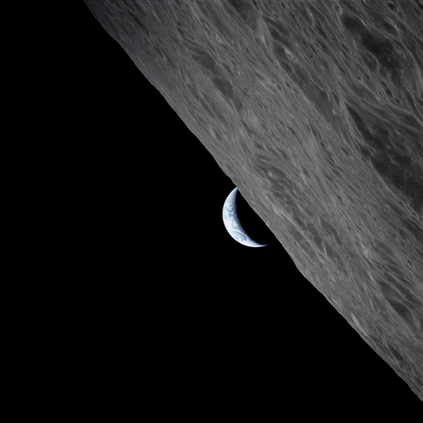 The crescent Earth rises above the lunar horizon taken from the Apollo  spacecraft in lunar orbit during final lunar landing mission in the Apollo program Credits NASA 