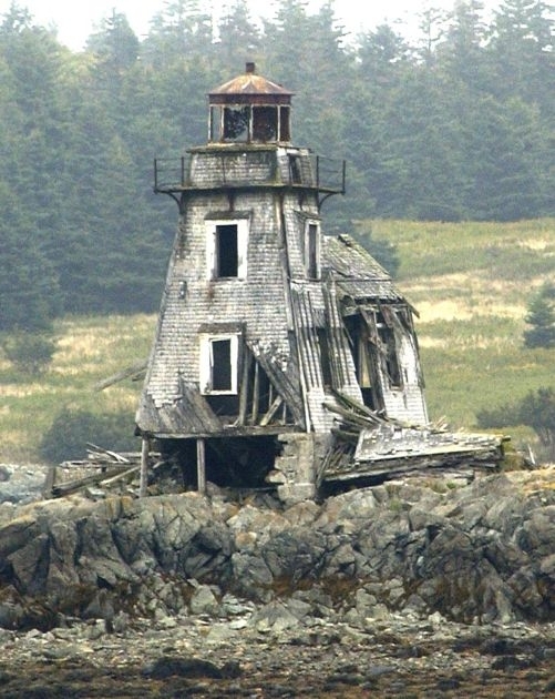 The foundation crumbles beneath the Grand Harbor Lighthouse on Fish Fluke Point Ross Island Canada 