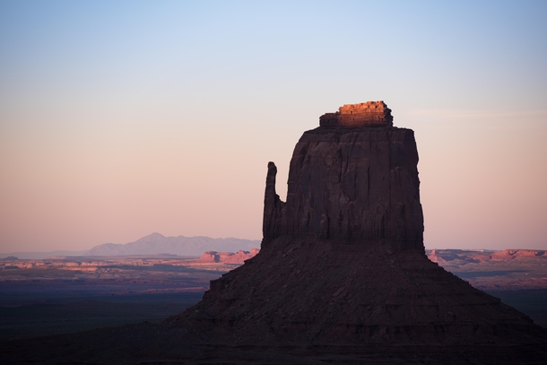 The last bit of sunset light hitting the top of East Mitten Monument Valley Navajo Nation AZUT USA 
