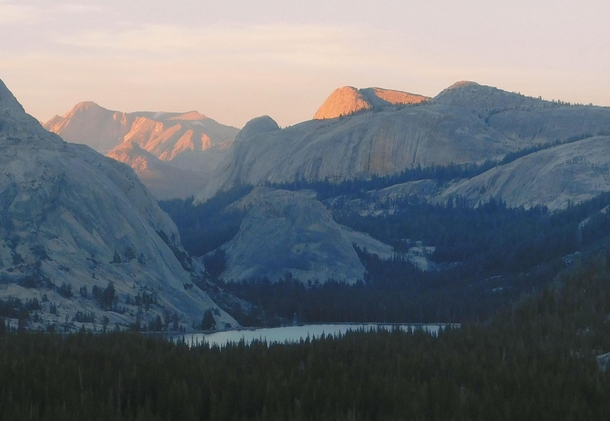 The last light of the day illuminates the mountaintops above Tenaya Lake in the Yosemite high country 