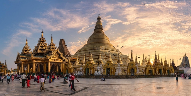 The massive  meter high gold plated Shwedagon Pagoda in Yangon also known as the Golden Pagoda has its main stupa surrounded by  small stupas Historical evidence suggests the pagoda was built around the th century