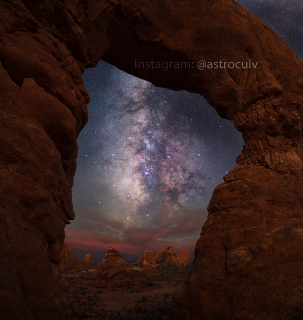 The Milky Way over Arches National Park through Turret Arch - Moab Utah 