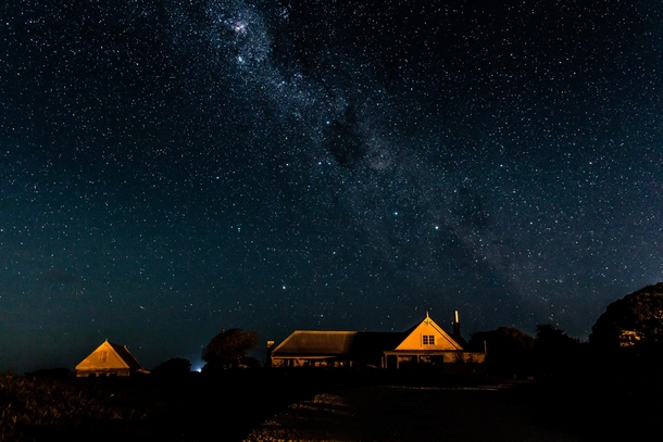 The Milky Way rising over an old whaling station in Kaikoura New Zealand 