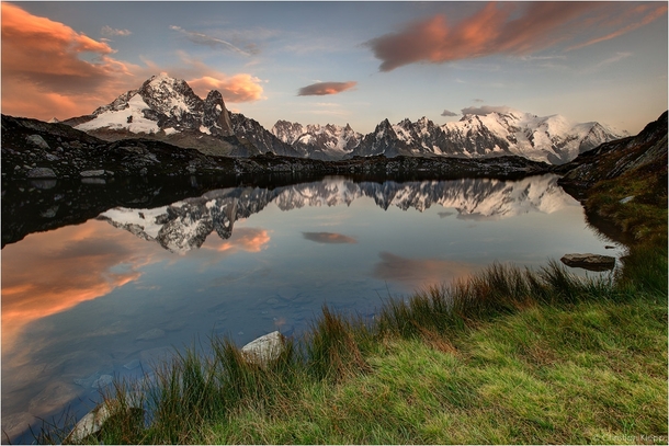 The Mont Blanc massif reflecting into Lac de Chsery Switzerland  by Christian Klepp