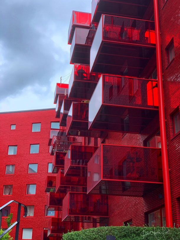 The Muddus neighborhood in Stockholm Sweden stands out through its large jumping balconies and its faade cladding of clear red glazed brick Architect Wingrdh 
