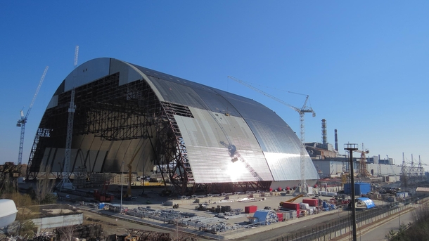 The New Safe Confinement arch here under construction but now straddling the bursten Chernobyl nuclear reactor 