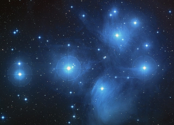 The Pleiades also known as the Seven Sisters is a neighboring star cluster located  ly away in the constellation Taurus It can be easily seen with the naked eye and has an apparent magnitude of  The open cluster consists of approx  luminous blue stars 