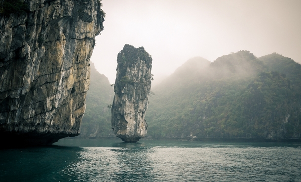 The resilient beautiful longstanding lone rock of Ha Long Bay Vietnam 