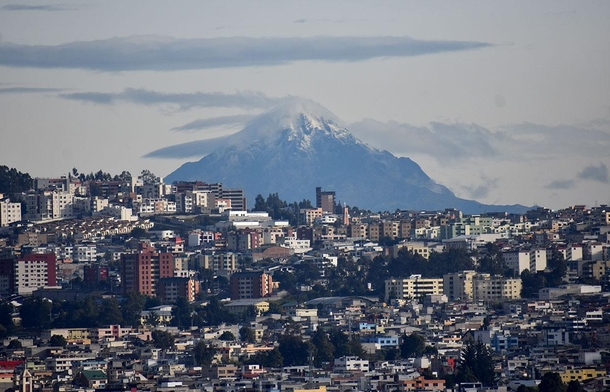 The snow-capped Cotacachi volcano rises above Quito Ecuador