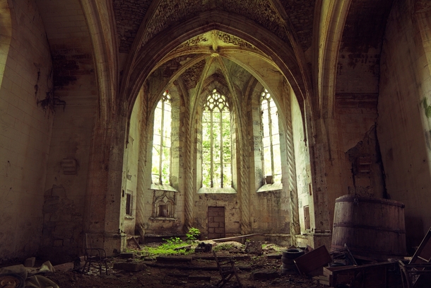The sun illuminates an abandoned and overgrown church strewn with debris  By Lauric Gourbal Photographies