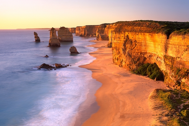 The Twelve Apostles glistening in the golden light Great Ocean Road Australia 