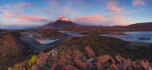 The twin peaks of the Parinacota and Pomerape volcanoes in Lauca Chile  by Mike Reyfman