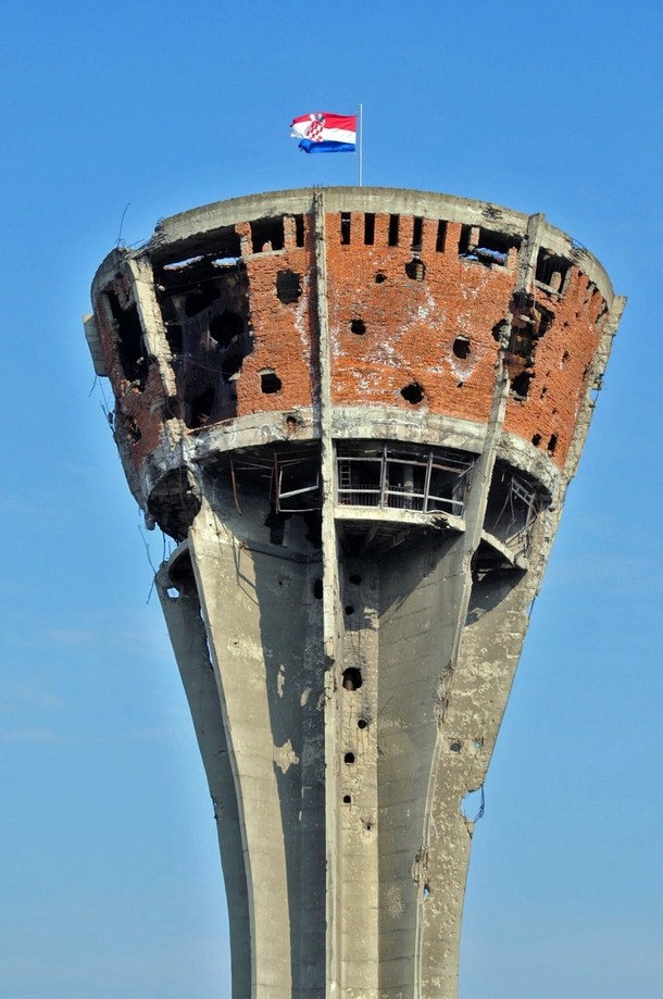 The Vukovar water tower Heavily damaged in the Battle of Vukovar the tower has been preserved as a symbol of the conflict Photo by anji on flickr 