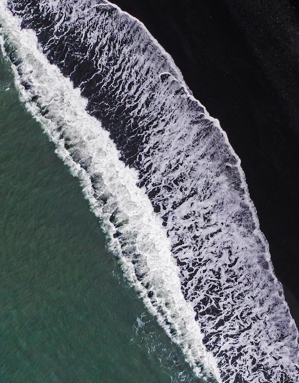 The waves breaking at a beach of black lava sand in Iceland  - more of my abstract landscapes at insta glacionaut