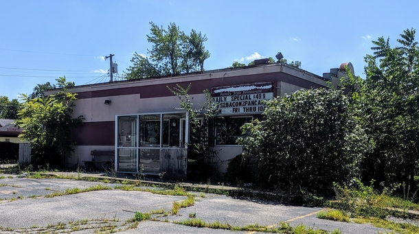 This family restaurant in Moraine Ohio - still boasting its last pancake special - is slowly being taken over by nearby greenery