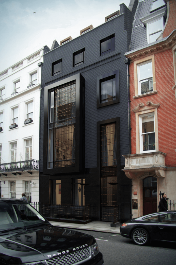 This London house got a contemporary upgrade when it changed its vintage brick color palette for a dramatic black external 