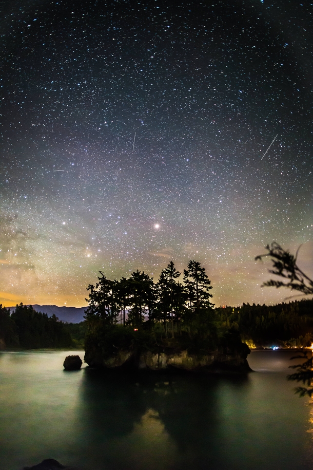 This lovely island captured my attention for most of the night Here is Mars rising over the Salt Creek Campgrounds in Washington State 