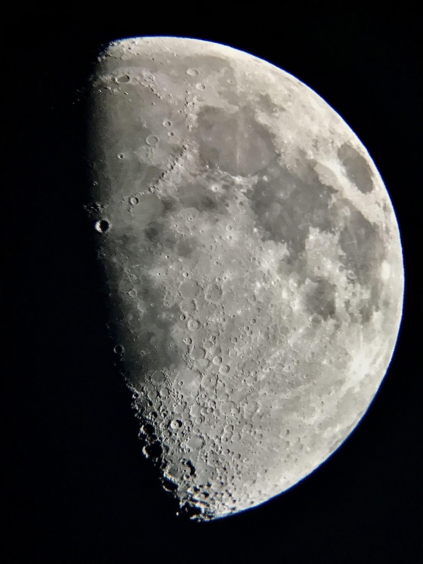 This picture of the Moon I captured with just a  telescope and an iPhone I held up to it