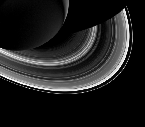 Tiny Mimas and Saturns ring spokes cassini released march  